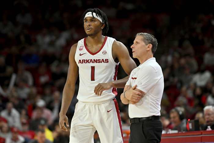 Arkansas coach Eric Musselman talks to Ricky Council IV (1) as they play Troy during the second half of an NCAA college basketball game Monday, Nov. 28, 2022, in Fayetteville, Ark. (AP Photo/Michael Woods
